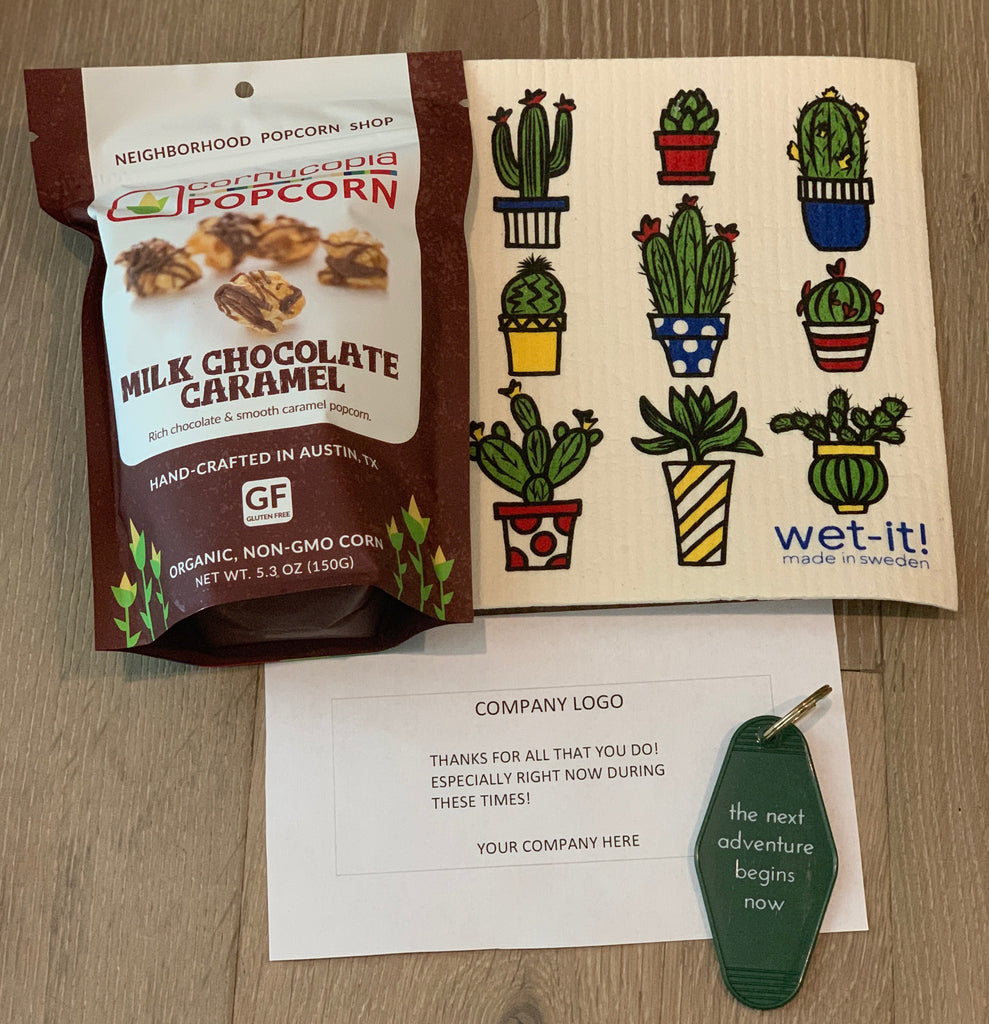 Corporate care package including reusable dish cloth, milk chocolate caramel popcorn, and vintage motel keychain from Diament Jewelry, a gift shop in Washington, DC.