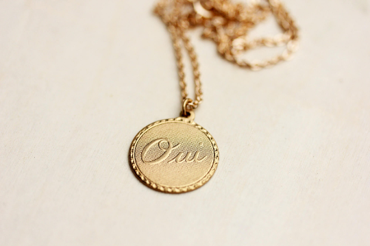 Oui gold necklace from Diament Jewelry, a gift shop in Washington, DC.