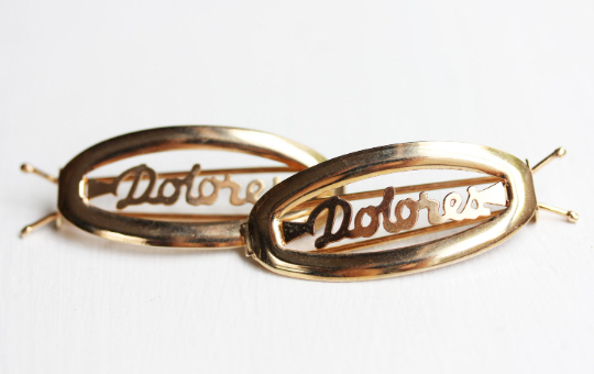 Vintage Dolores gold hair clips from Diament Jewelry, a gift shop in Washington, DC.