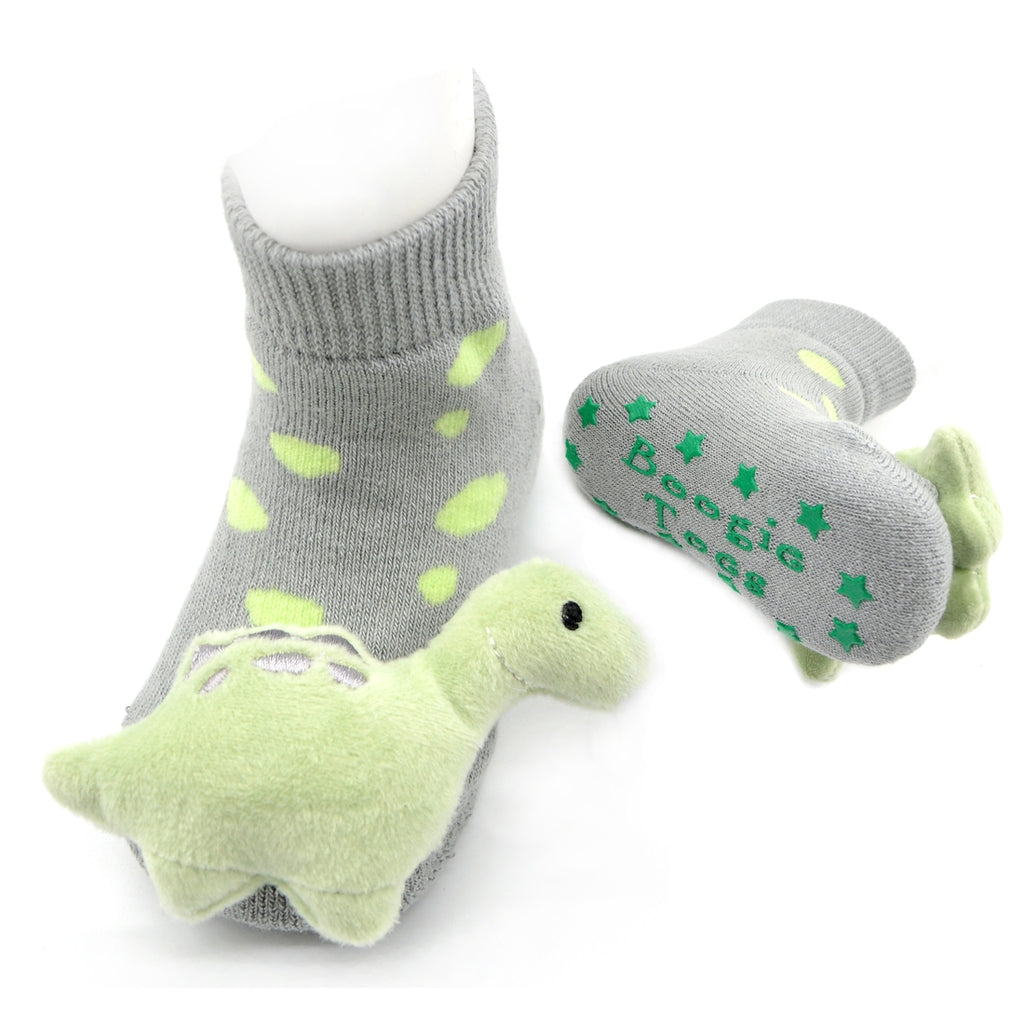 Boogie Toes Dinosaur Rattle Socks from Diament Jewelry, a gift shop in Washington, DC.