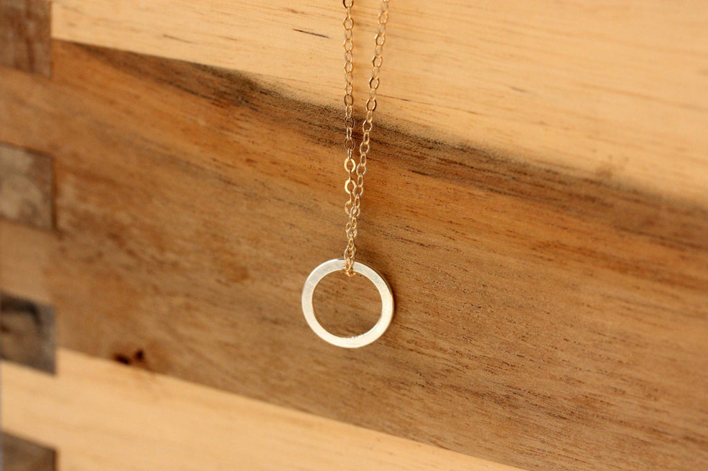 Gold fill chain and sterling silver circle necklace from Diament Jewelry, a gift shop in Washington, DC.