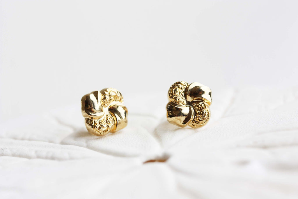 Vintage gold swirl earrings from Diament Jewelry, a gift shop in Washington, DC.