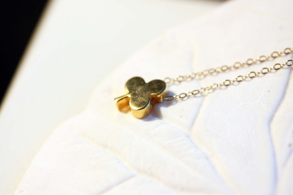 Gold Clover Charm Necklace from Diament Jewelry, a gift shop in Washington, DC.