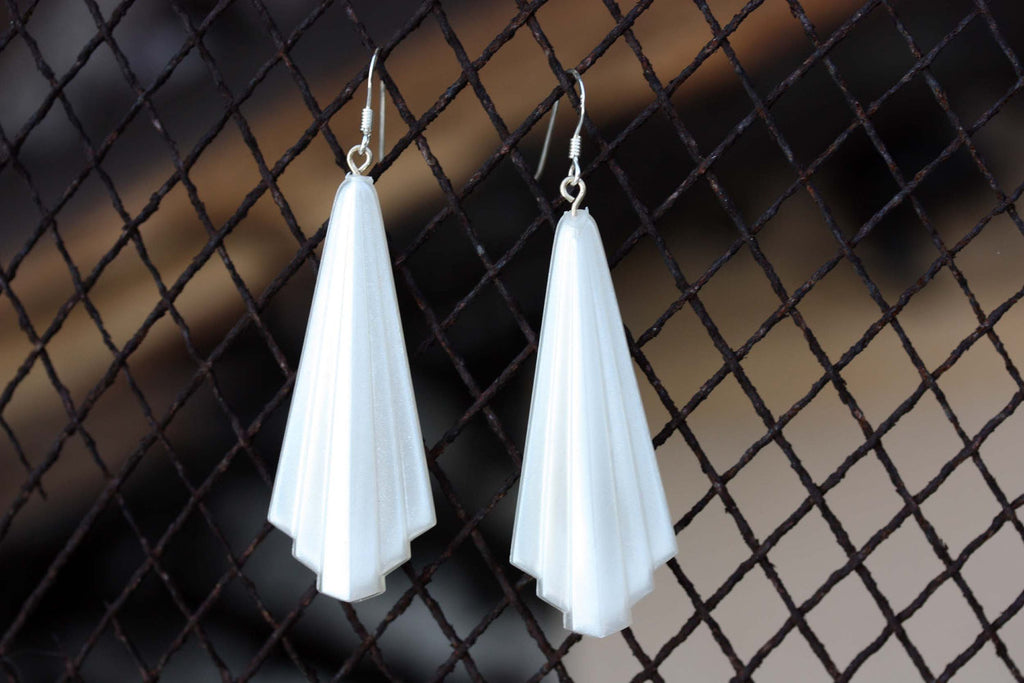 Vintage white art deco dangle earrings from Diament Jewelry, a gift shop in Washington, DC.