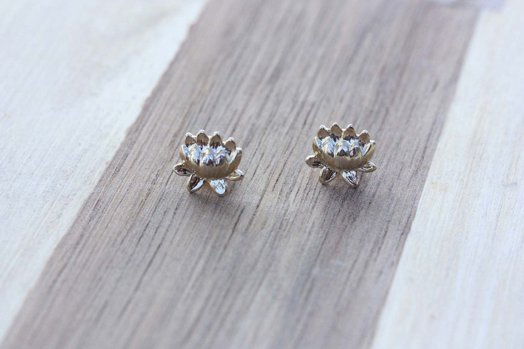 Small vintage silver lotus studs from Diament Jewelry, a gift shop in Washington, DC.
