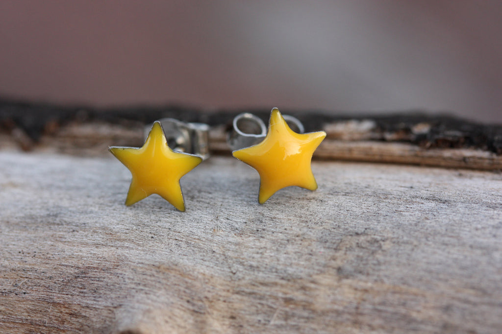 Tiny Yellow Enamel Star Studs from Diament Jewelry, a gift shop in Washington, DC.