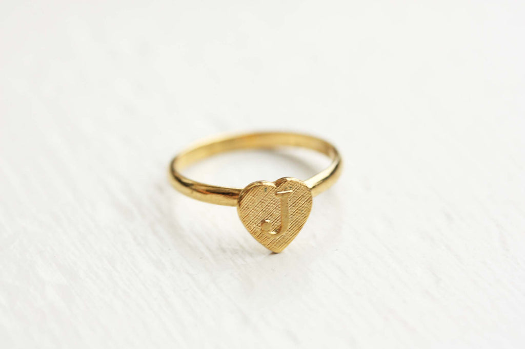 Vintage adjustable gold initial ring from Diament Jewelry, a gift shop in Washington, DC.