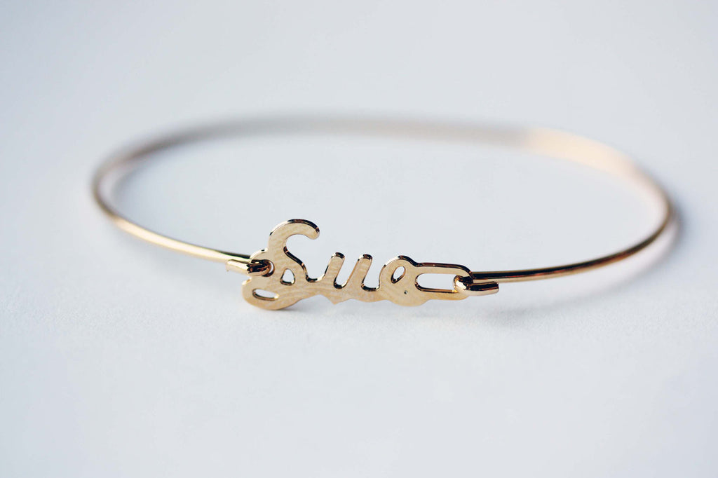 Vintage Sue gold name bracelet from Diament Jewelry, a gift shop in Washington, DC.