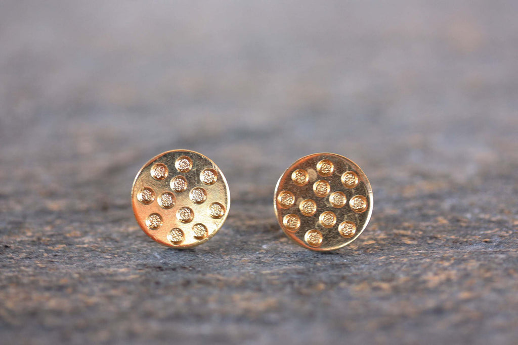 Gold Polka Dot Studs from Diament Jewelry, a gift shop in Washington, DC.