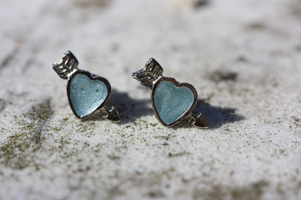 Blue and silver heart arrow studs from Diament Jewelry, a gift shop in Washington, DC.