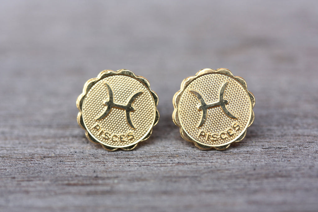 Gold Pisces astrology studs from Diament Jewelry, a gift shop in Washington, DC.
