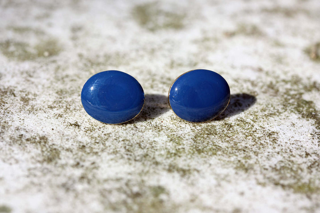 Blue oval studs from Diament Jewelry, a gift shop in Washington, DC.