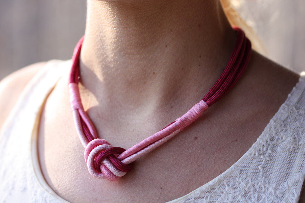 Pink and red rope knot necklace from Diament Jewelry, a gift shop in Washington, DC.