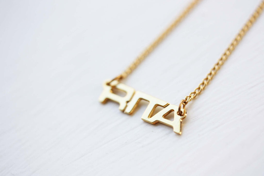 Vintage Rita gold name necklace from Diament Jewelry, a gift shop in Washington, DC.
