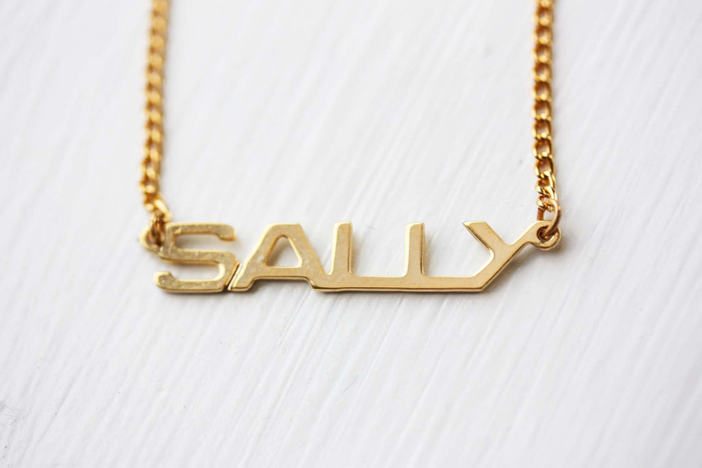 Vintage Sally gold name necklace from Diament Jewelry, a gift shop in Washington, DC.