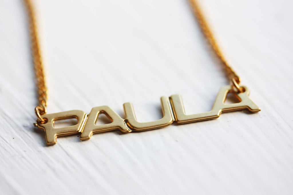 Vintage Paula gold name necklace from Diament Jewelry, a gift shop in Washington, DC.