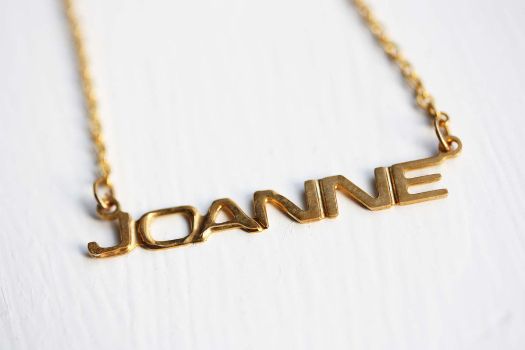 Vintage Joanne gold name necklace from Diament Jewelry, a gift shop in Washington, DC.