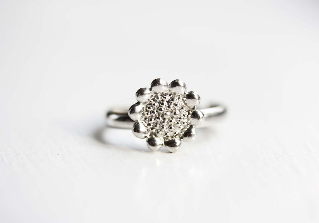 Silver sunflower ring from Diament Jewelry, a gift shop in Washington, DC.