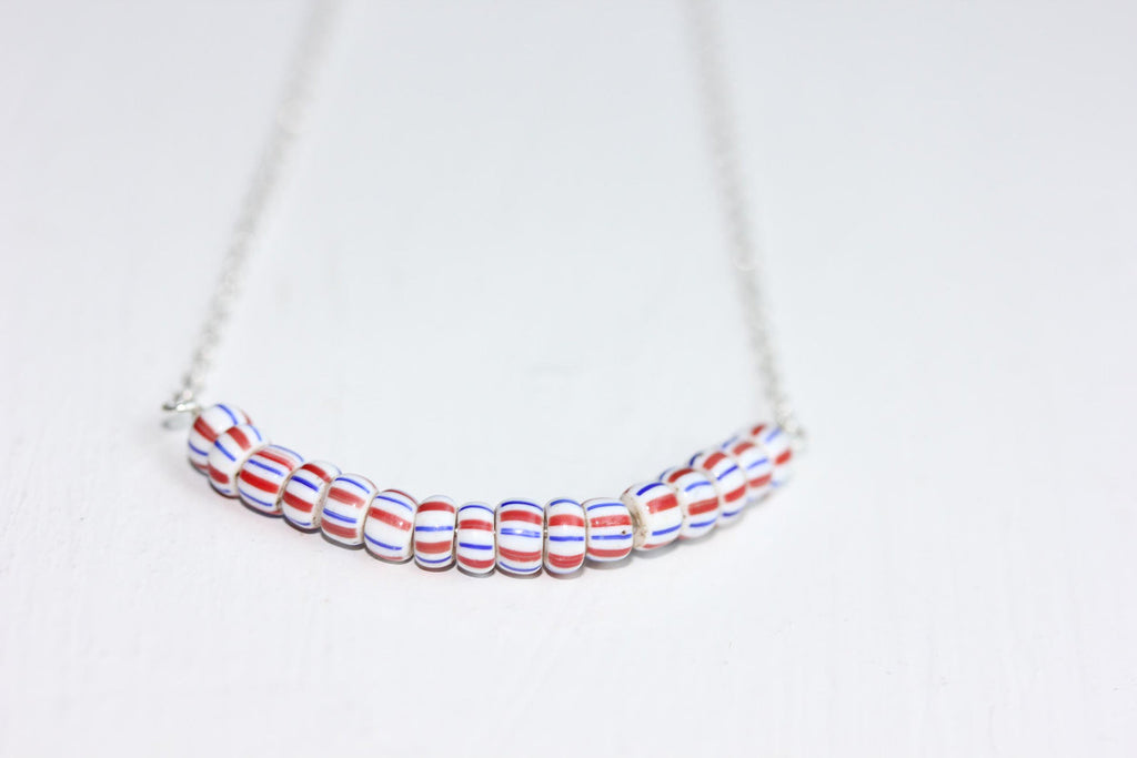 Blue and red stripes necklace from Diament Jewelry, a gift shop in Washington, DC.