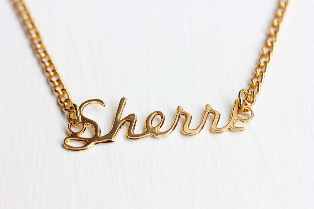 Vintage Sherri gold name necklace from Diament Jewelry, a gift shop in Washington, DC.