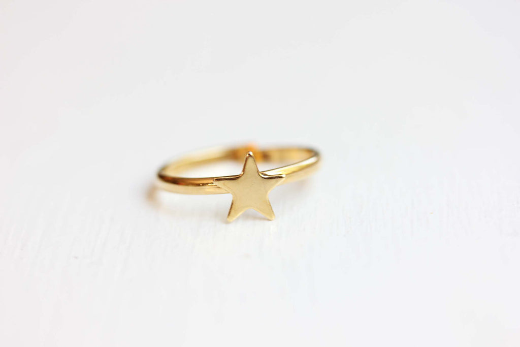 Tiny gold star adjustable ring from Diament Jewelry, a gift shop in Washington, DC.