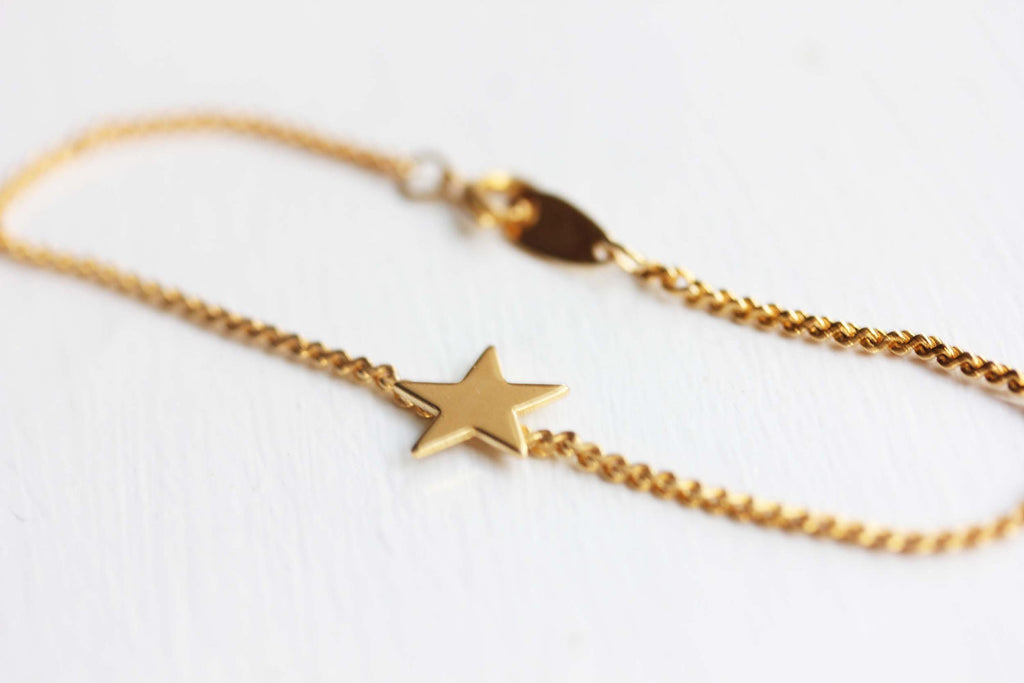 Tiny gold star bracelet from Diament Jewelry, a gift shop in Washington, DC.