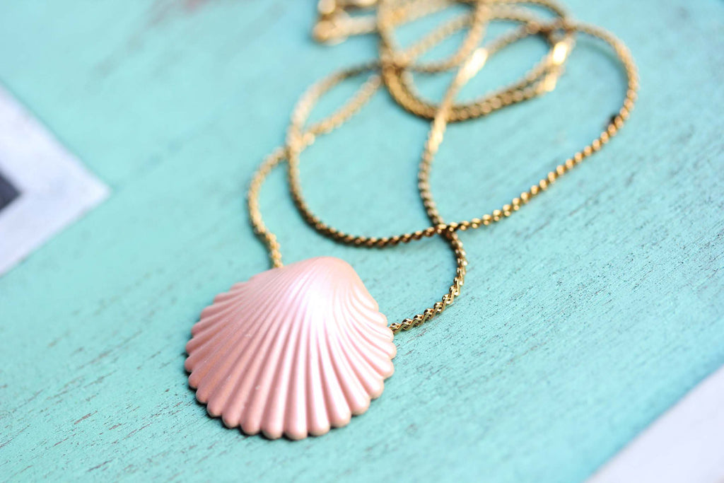 Pink seashell gold chain necklace from Diament Jewelry, a gift shop in Washington, DC.