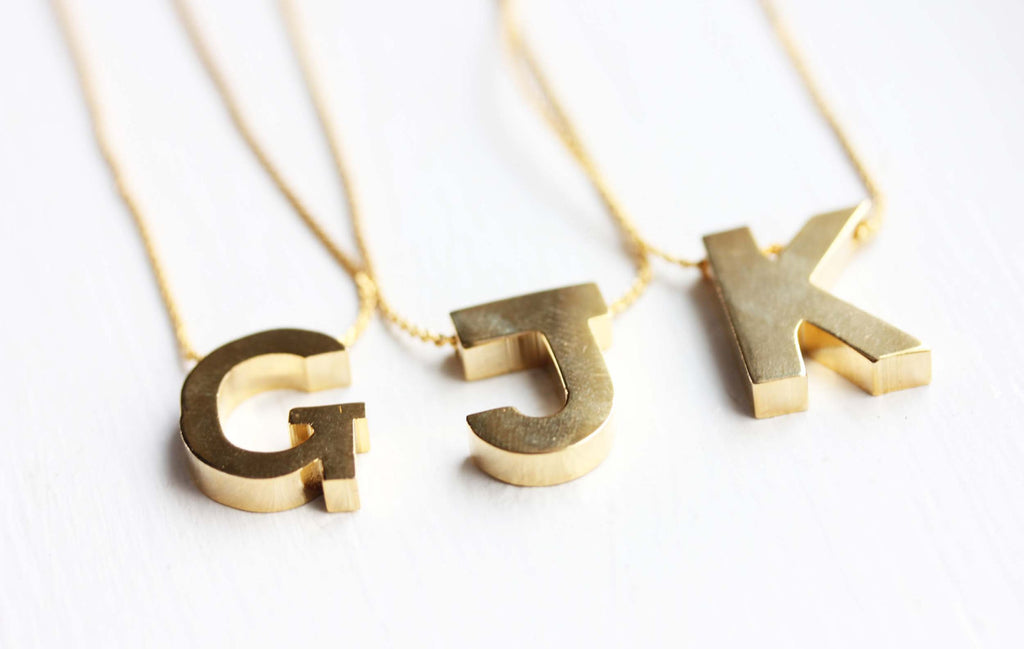 Large Initial gold letter necklace from Diament Jewelry, a gift shop in Washington, DC.