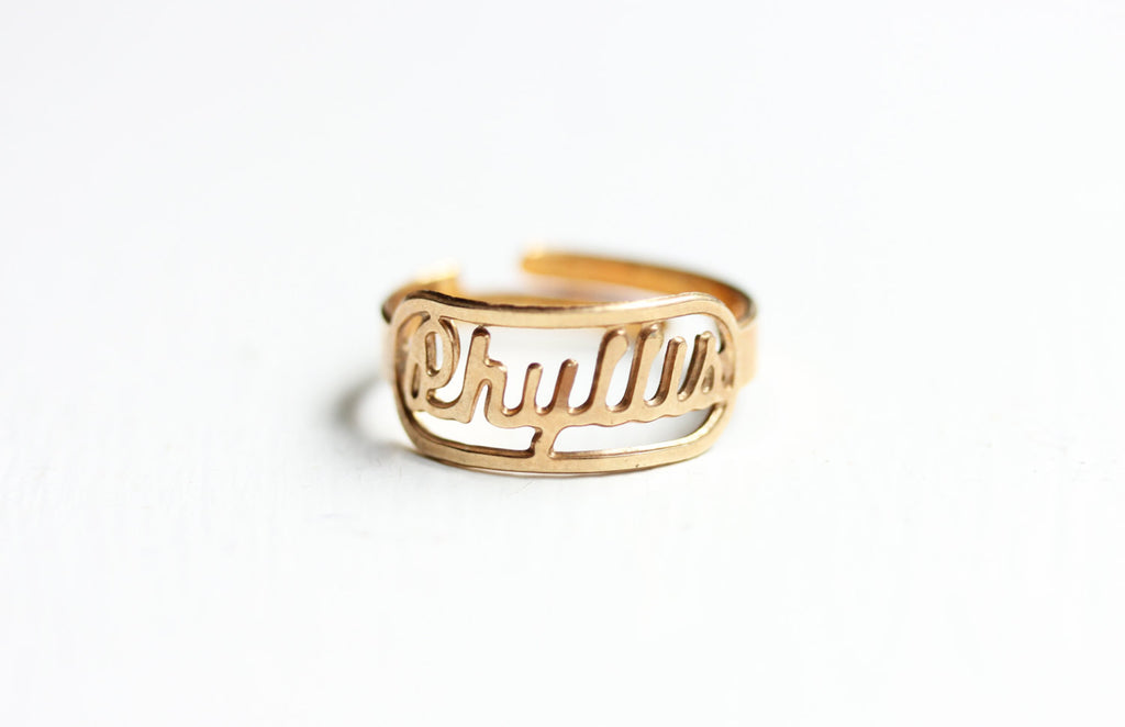 Vintage Phyllis gold name ring from Diament Jewelry, a gift shop in Washington, DC.