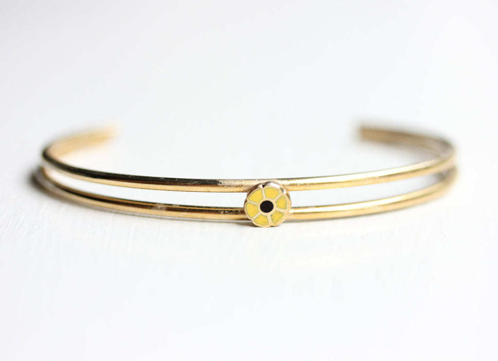 Yellow daisy cuff bracelet from Diament Jewelry, a gift shop in Washington, DC.
