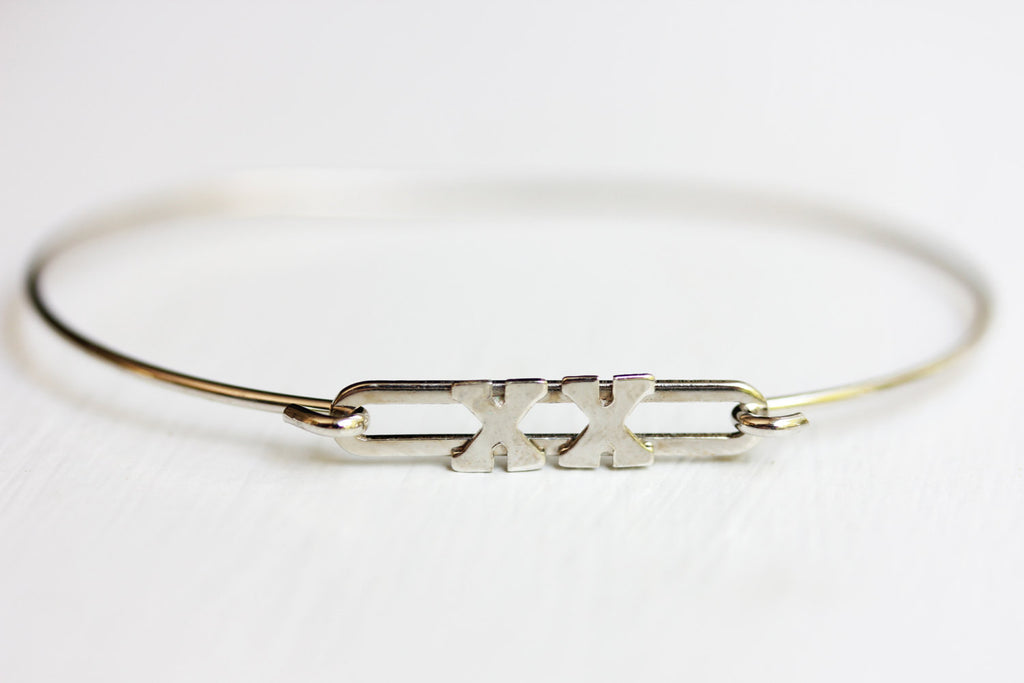 Silver XX bracelet from Diament Jewelry, a gift shop in Washington, DC.
