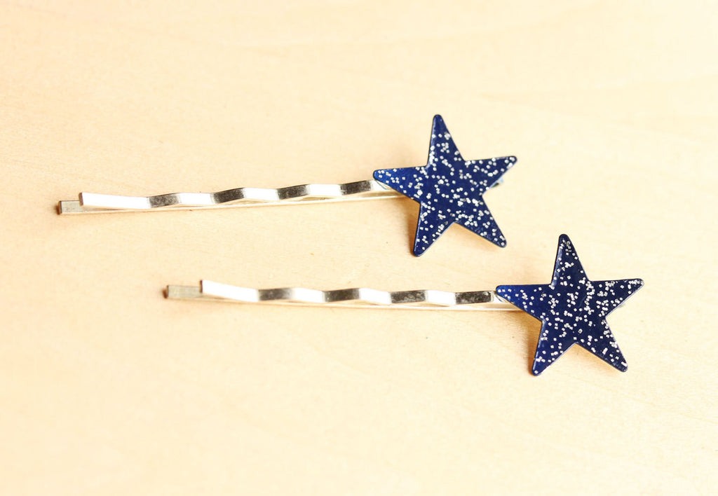 Vintage navy glitter star bobby pins from Diament Jewelry, a gift shop in Washington, DC.