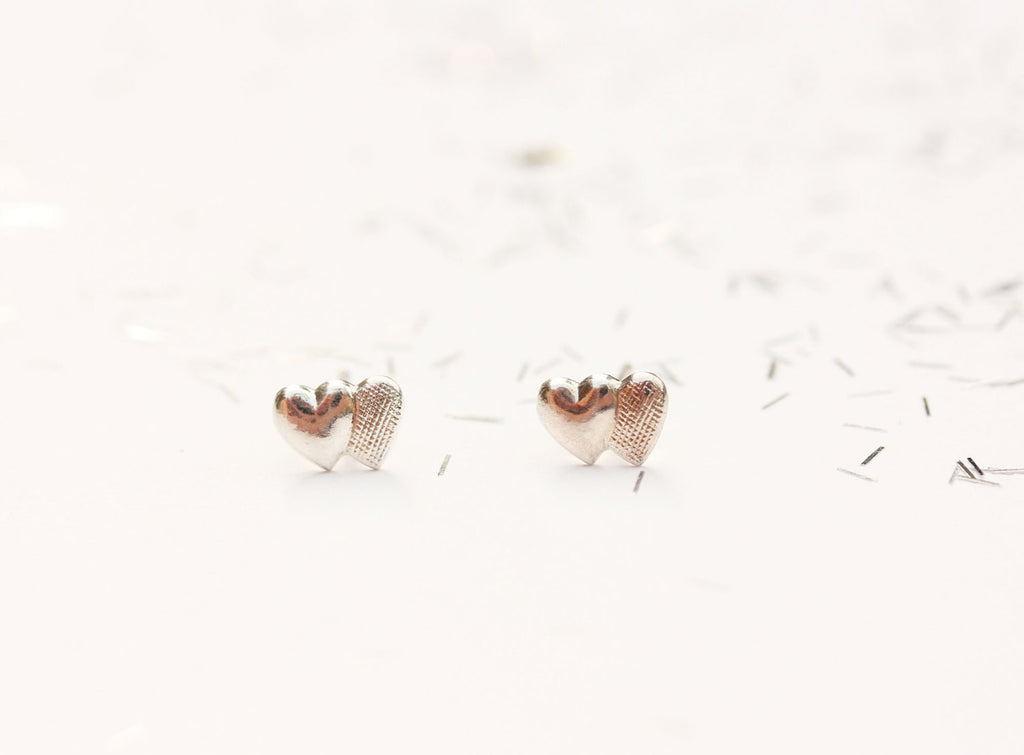 Tiny sterling silver double heart studs from Diament Jewelry, a gift shop in Washington, DC.