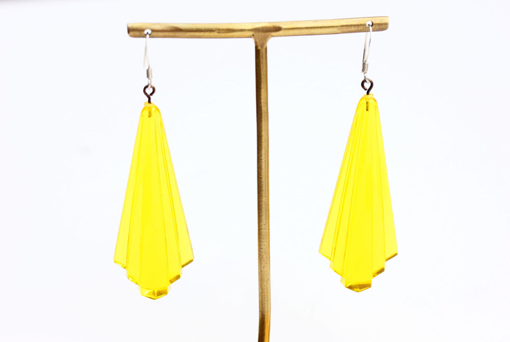 Yellow art deco dangle earrings from Diament Jewelry, a gift shop in Washington, DC.