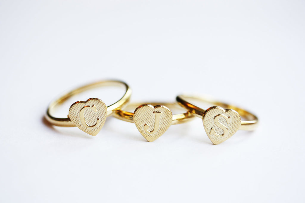 Vintage adjustable gold initial ring from Diament Jewelry, a gift shop in Washington, DC.
