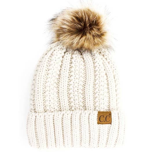 White Lined Cable Pom Beanie from Diament Jewelry, a gift shop in Washington, DC.