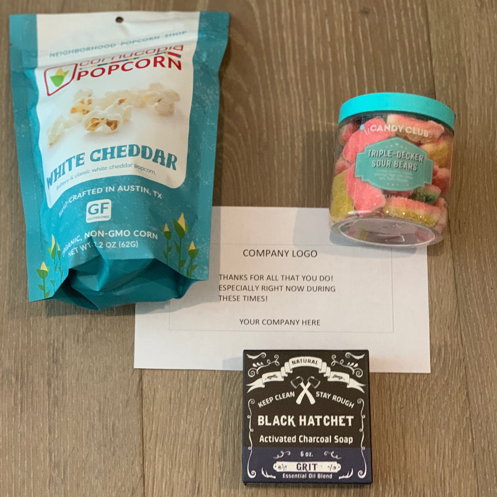 Corporate care package including white cheddar popcorn, triple decker sour bears, and charcoal bar soap from Diament Jewelry, a gift shop in Washington, DC.