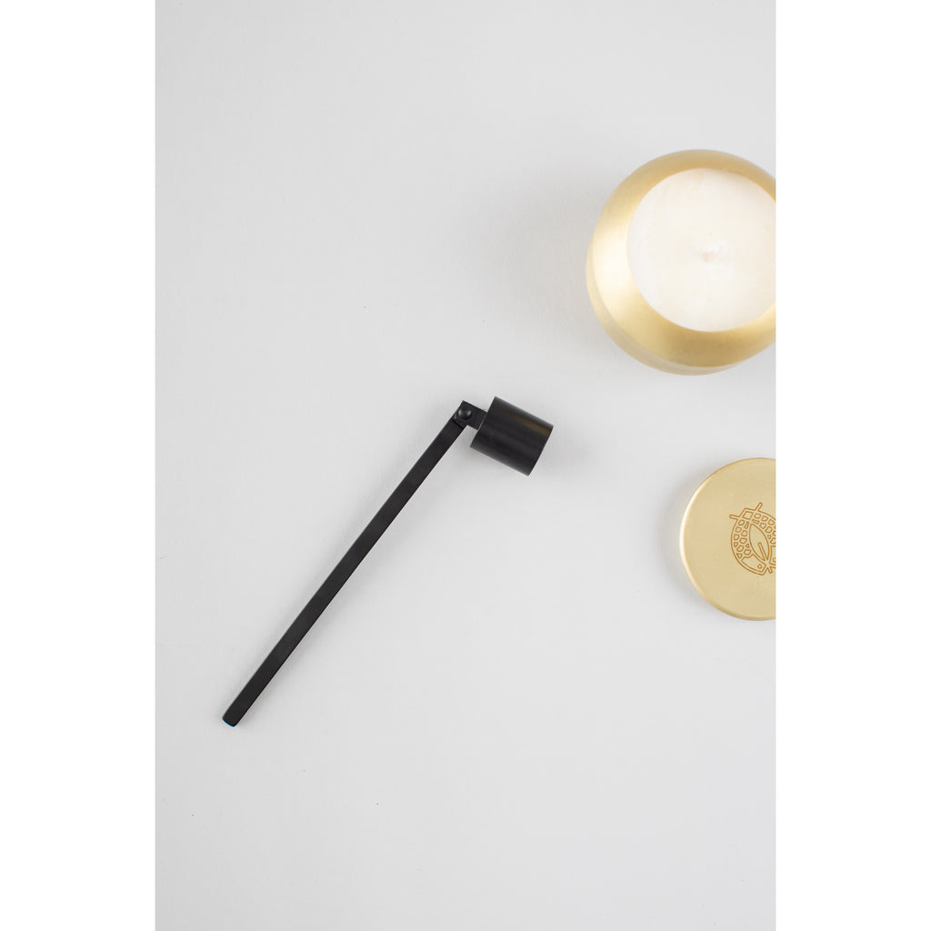 Black Candle Snuffer from Diament Jewelry, a gift shop in Washington, DC.