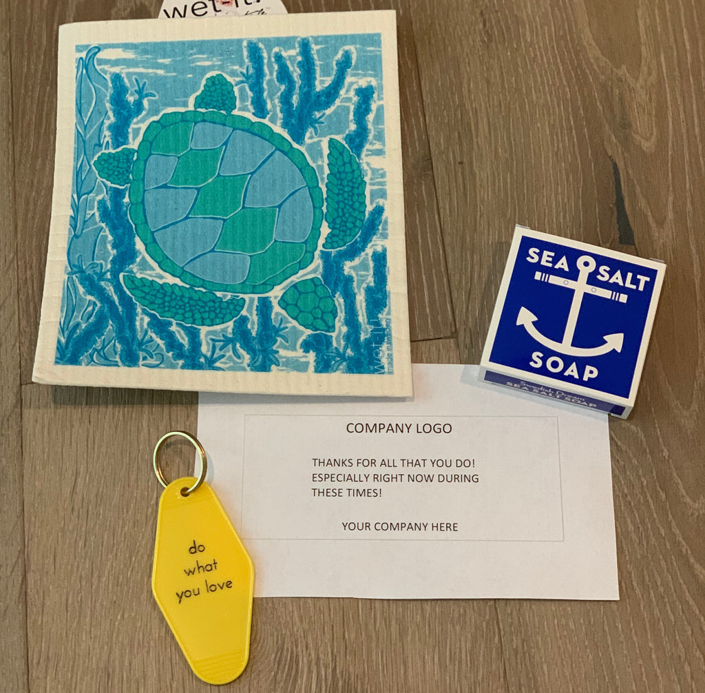 Corporate care package including reusable dish cloth, vintage motel keychain, and sea salt bar soap from Diament Jewelry, a gift shop in Washington, DC.