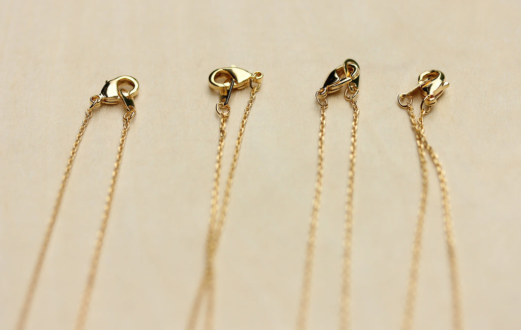 Dainty real gem stone gold circle necklaces from Diament Jewelry, a gift shop in Washington, DC.