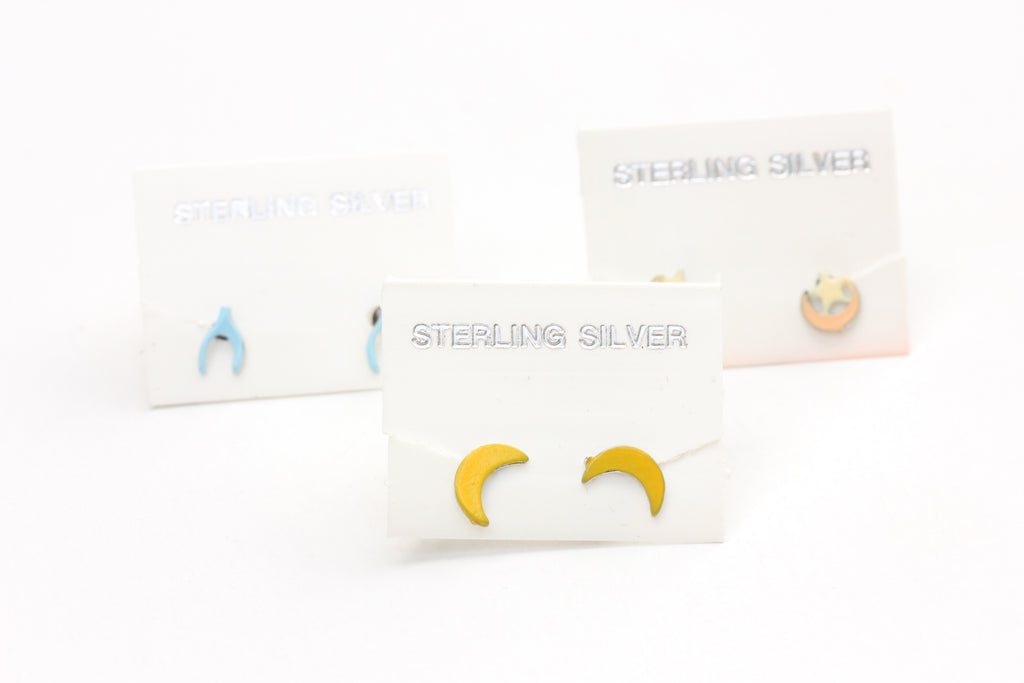Sterling silver moon, wishbone, and moon/star studs from Diament Jewelry, a gift shop in Washington, DC.