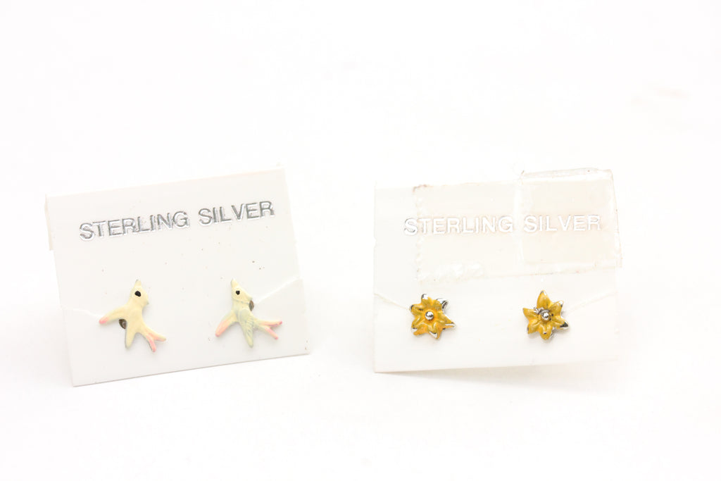 Sterling silver flower and bird studs from Diament Jewelry, a gift shop in Washington, DC.