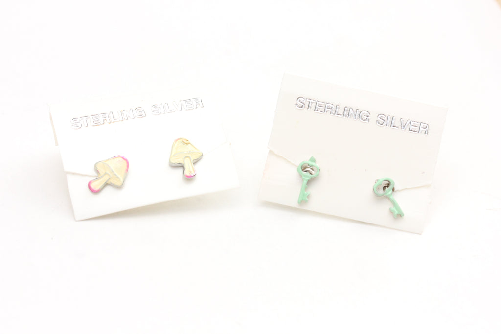 Sterling silver mushroom and key studs from Diament Jewelry, a gift shop in Washington, DC.
