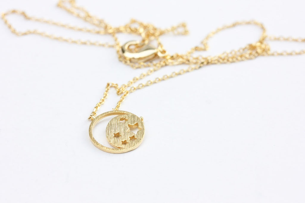 Gold Moon and Star Charm Necklace from Diament Jewelry, a gift shop in Washington, DC.