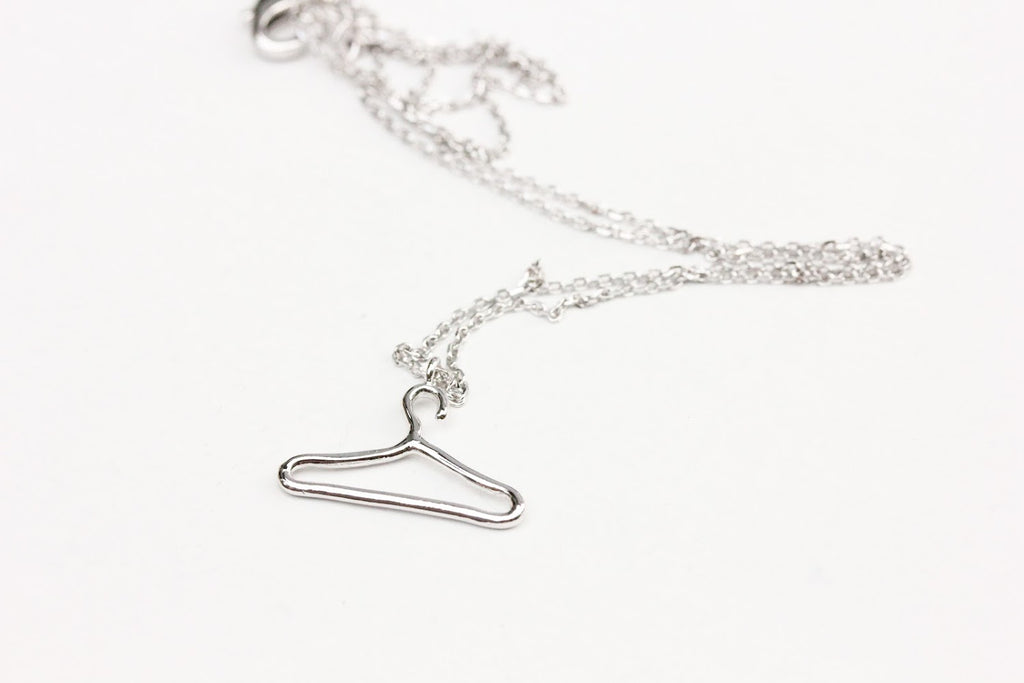 Silver hanger charm necklace from Diament Jewelry, a gift shop in Washington, DC.