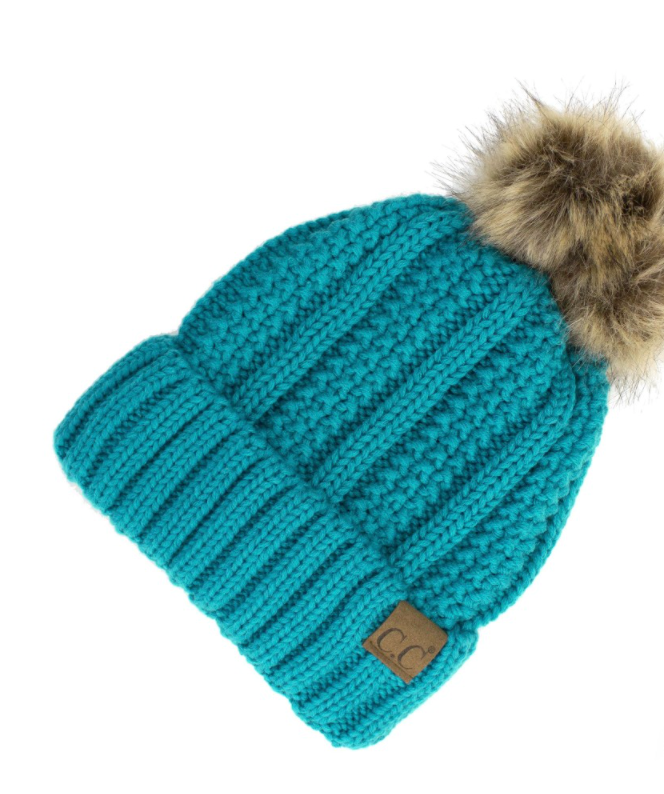 Teal Lined Cable Pom Beanie from Diament Jewelry, a gift shop in Washington, DC.