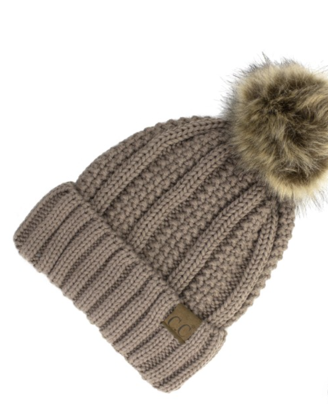 Tan Lined Cable Pom Beanie from Diament Jewelry, a gift shop in Washington, DC.