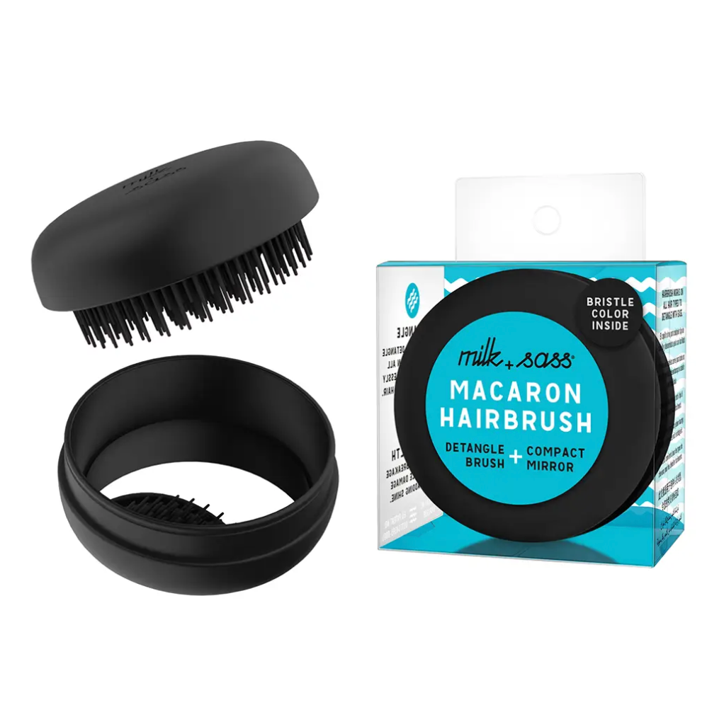 Black Travel Macaron Hair Brush from Diament Jewelry, a gift shop in Washington, DC.