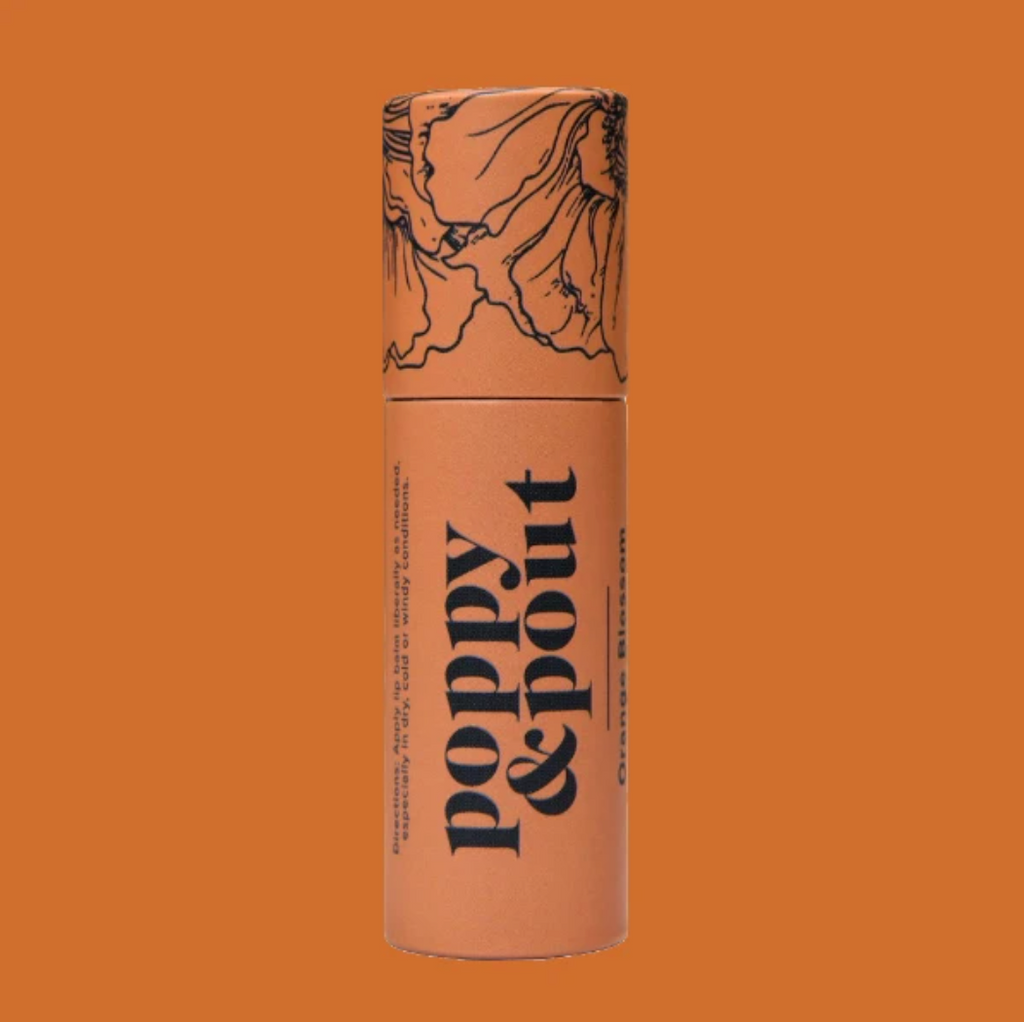 Poppy and Pout Orange Blossom Lip Balm from Diament Jewelry, a gift shop in Washington, DC.