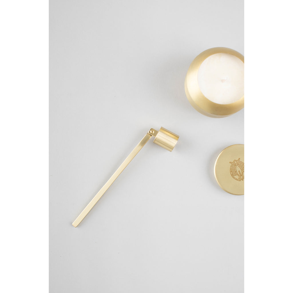 Gold Candle Snuffer from Diament Jewelry, a gift shop in Washington, DC.